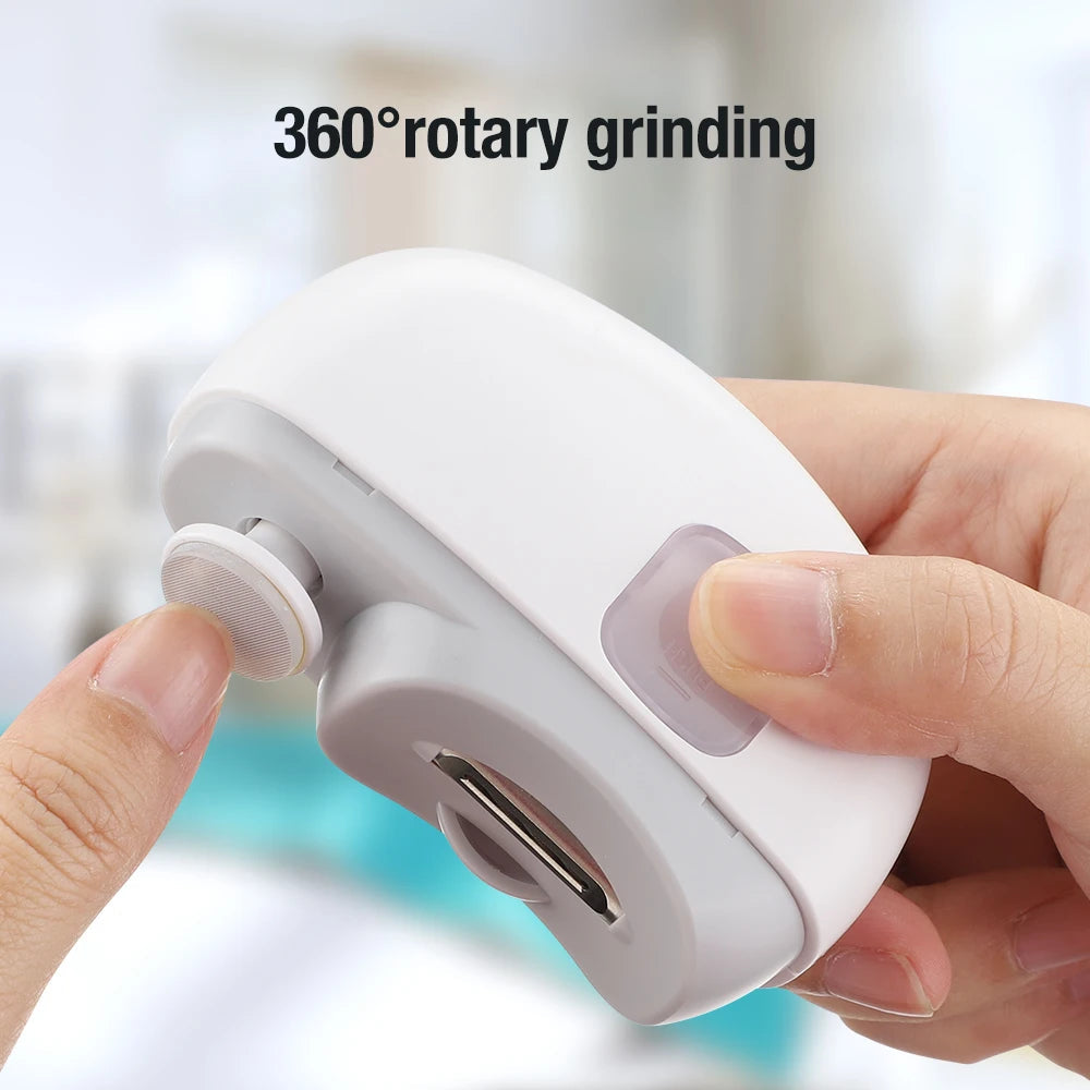 Fingertip touching the rotary grinder disc on the front of the Nailo trimmer