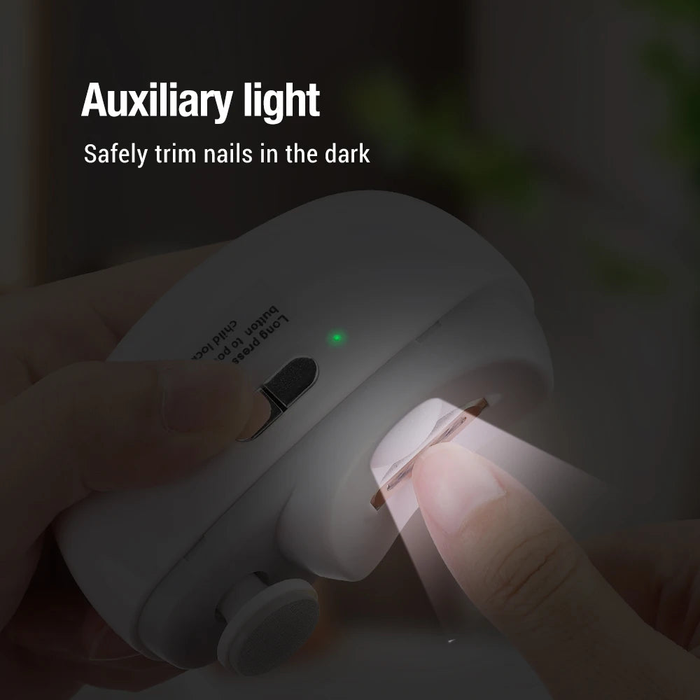 Nailo trimmer in a dark room with its built-in LED lighting a fingernail